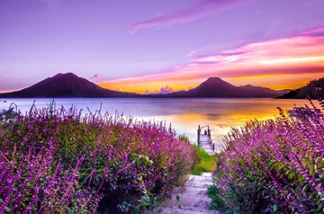 lake, meadow, mountains at sunset