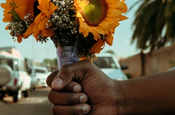 holding bouquet