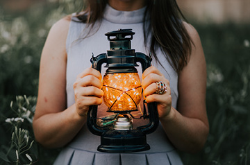 holding oil lantern