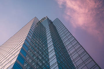 Tall building in front of a blue sky