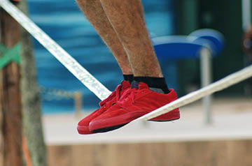 Person balancing on a tightrope