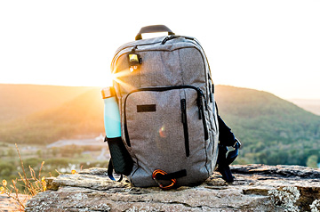 hiker's backpack on rocks