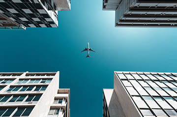 Airplane flying over city