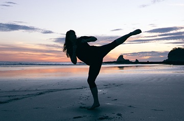 silhouette of martial arts on beach