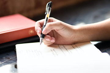 writing in notebook