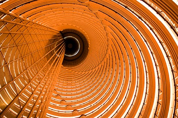 Interior spiral architecture with warm orange lighting