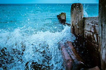 waves crashing against pier