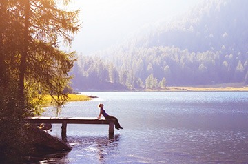 sitting on lake pier