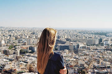 A woman looking out over a city
