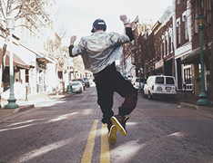 person dancing in city street