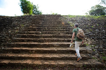 Man exploring stone ruins