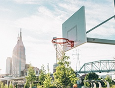 basketball goal, cityscape in background