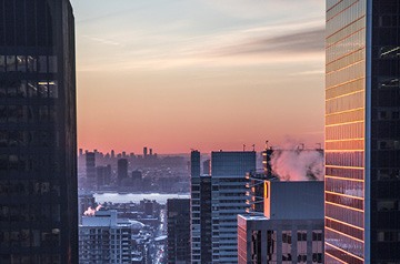 View of dawning day across tops of skyscrapers