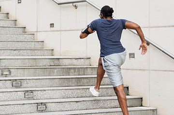 Person going up outdoor stairs