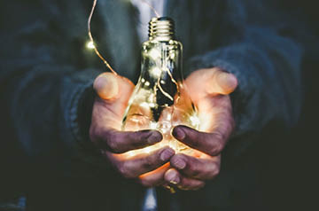 holding lightbulb