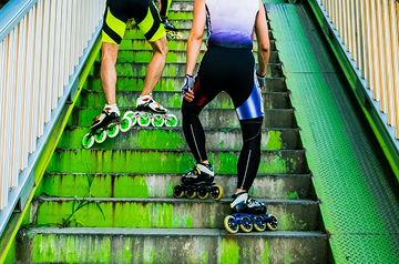 people walking up stairs in roller blades