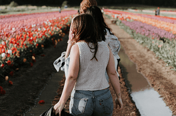 walking through rows of flowers
