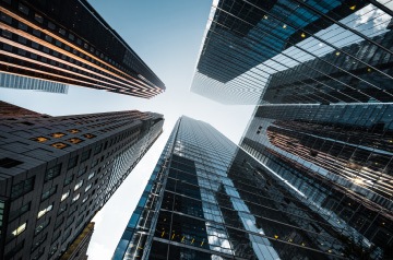 looking skyward through skyscrapers