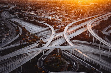 An aerial view of intertwining freeway overpasses.