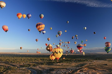Airborne view of a bunch of hot air balloons