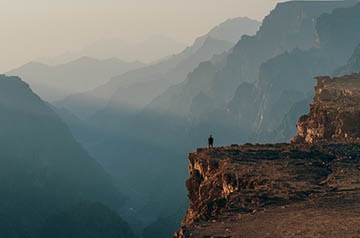 Person standing on a cliff