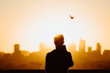watching sunset behind city skyline