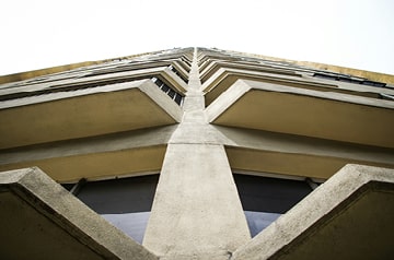 Looking skyward at geometric pattern created by side of skyscraper